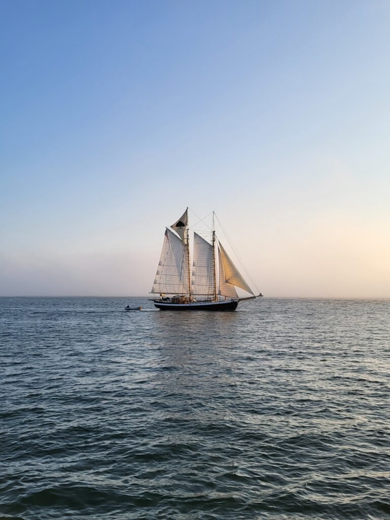 Gaff rigged schooners sailing in the evening glow in New England.